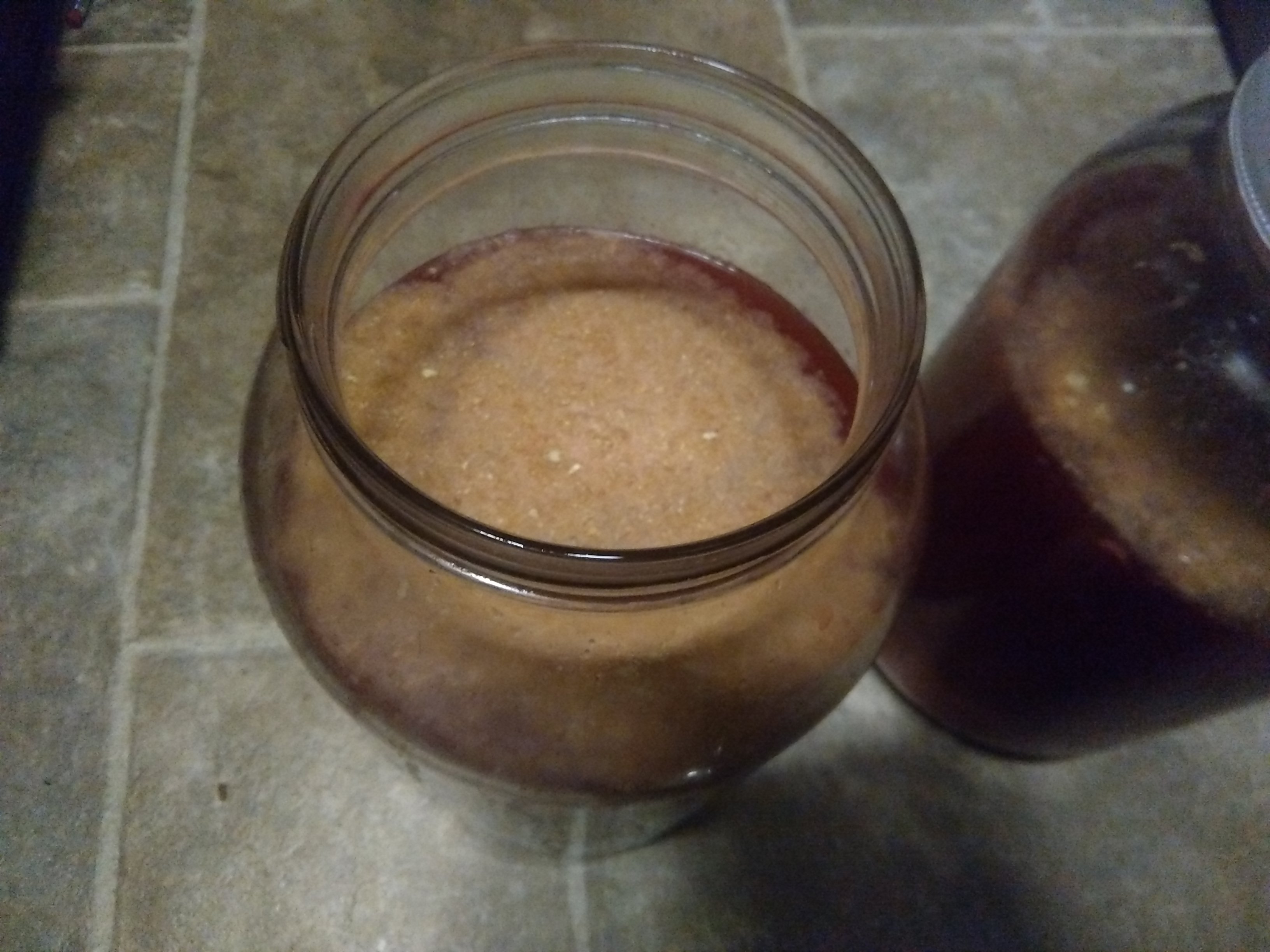 Powder floating on top of wine.